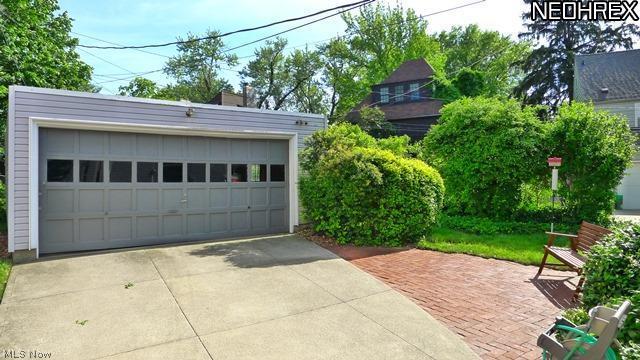 16406 Fernway Road Cleveland, OH 44120 - Photo 21 of 21 Two car detached garage and view of brick patio and cement driveway