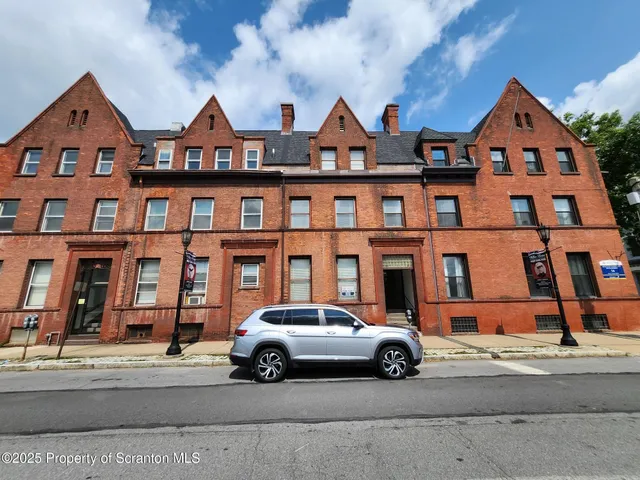 a car parked in front of a house