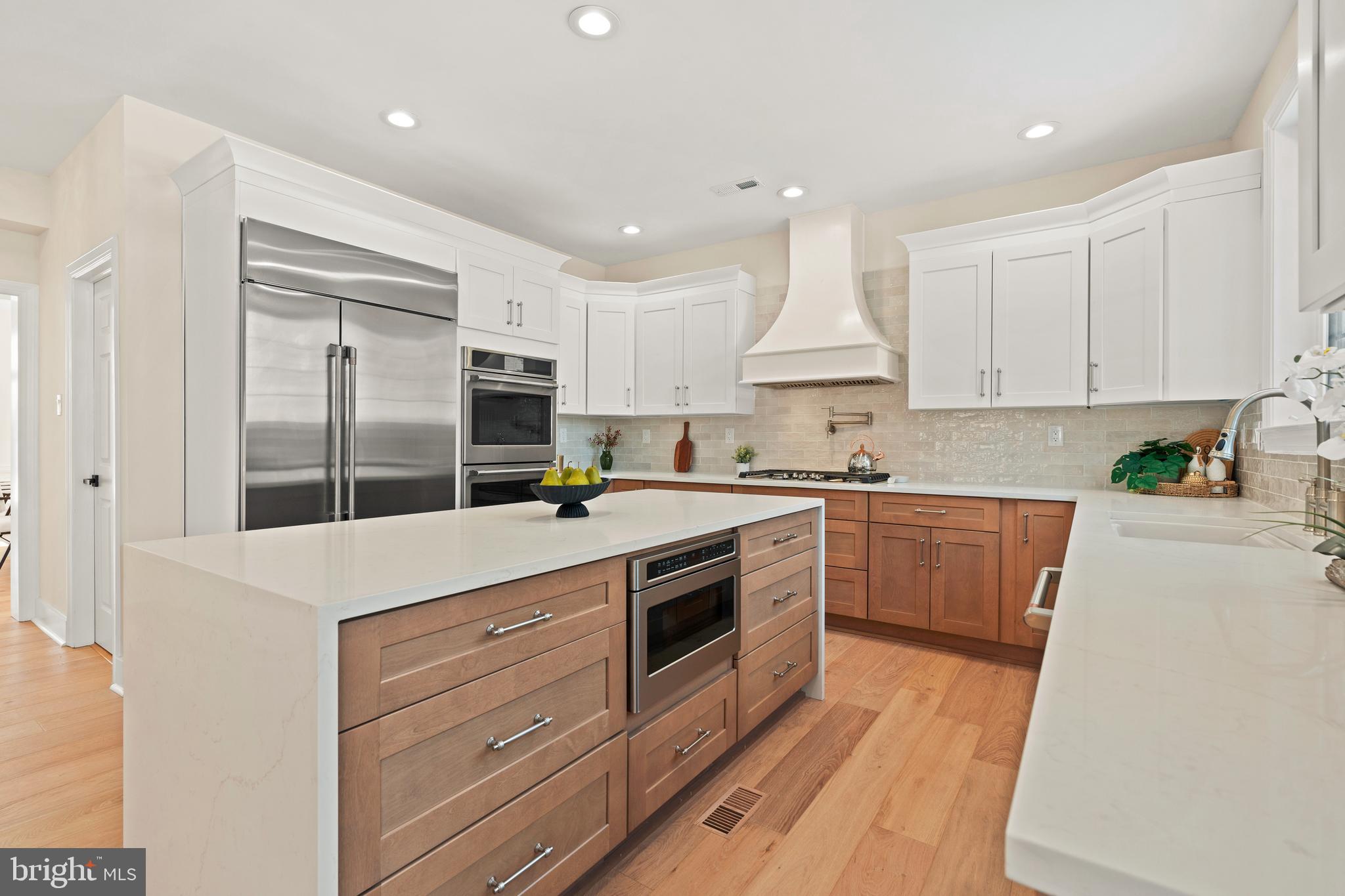 1586 Brookfield Road Newtown, PA 18940 - Photo 11 of 64 a kitchen with granite countertop white cabinets and white stainless steel appliances