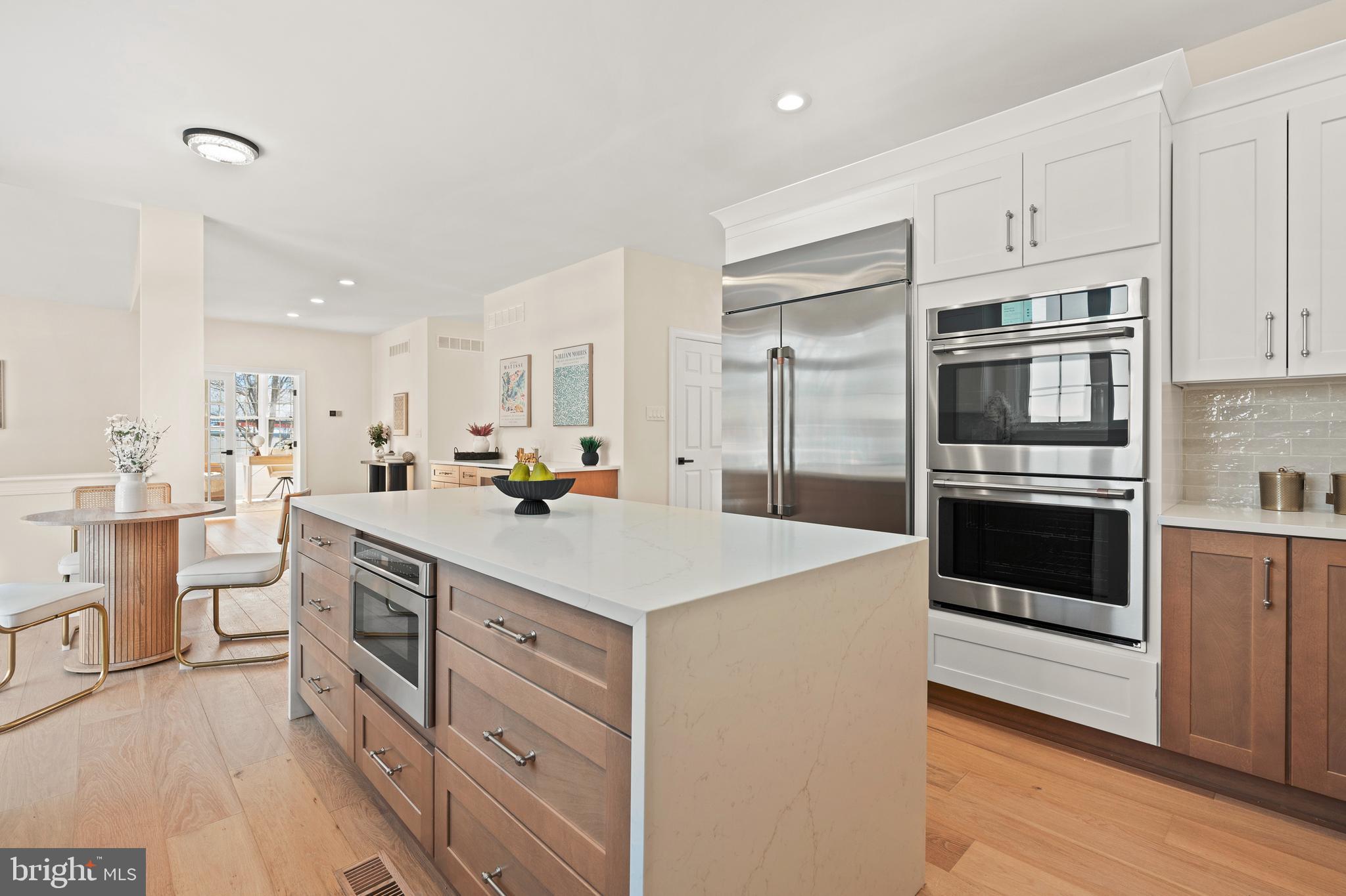 1586 Brookfield Road Newtown, PA 18940 - Photo 12 of 64 a large kitchen with kitchen island a sink a stove a refrigerator and a cabinets