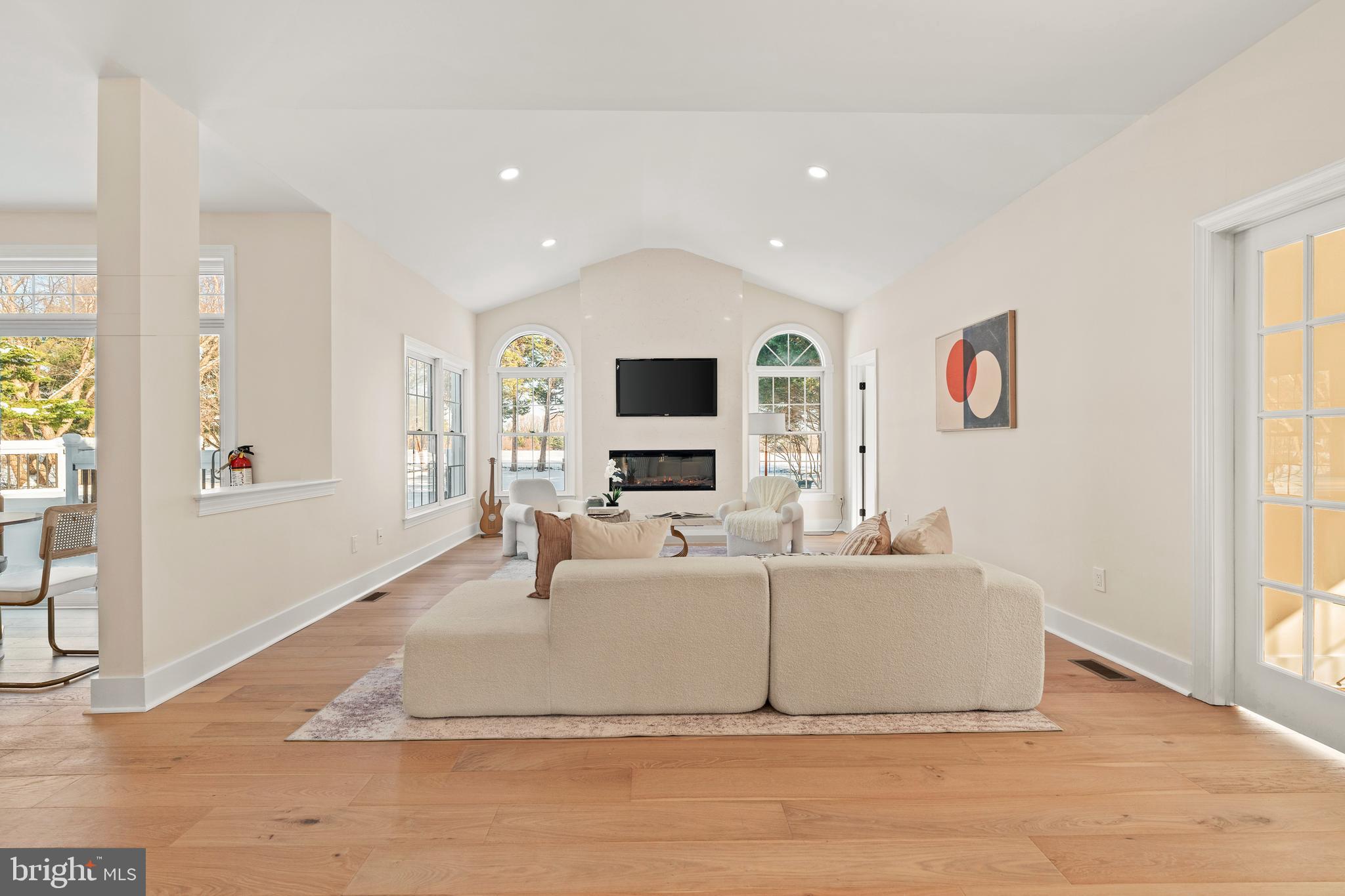 1586 Brookfield Road Newtown, PA 18940 - Photo 15 of 64 a living room with fireplace furniture and a flat screen tv