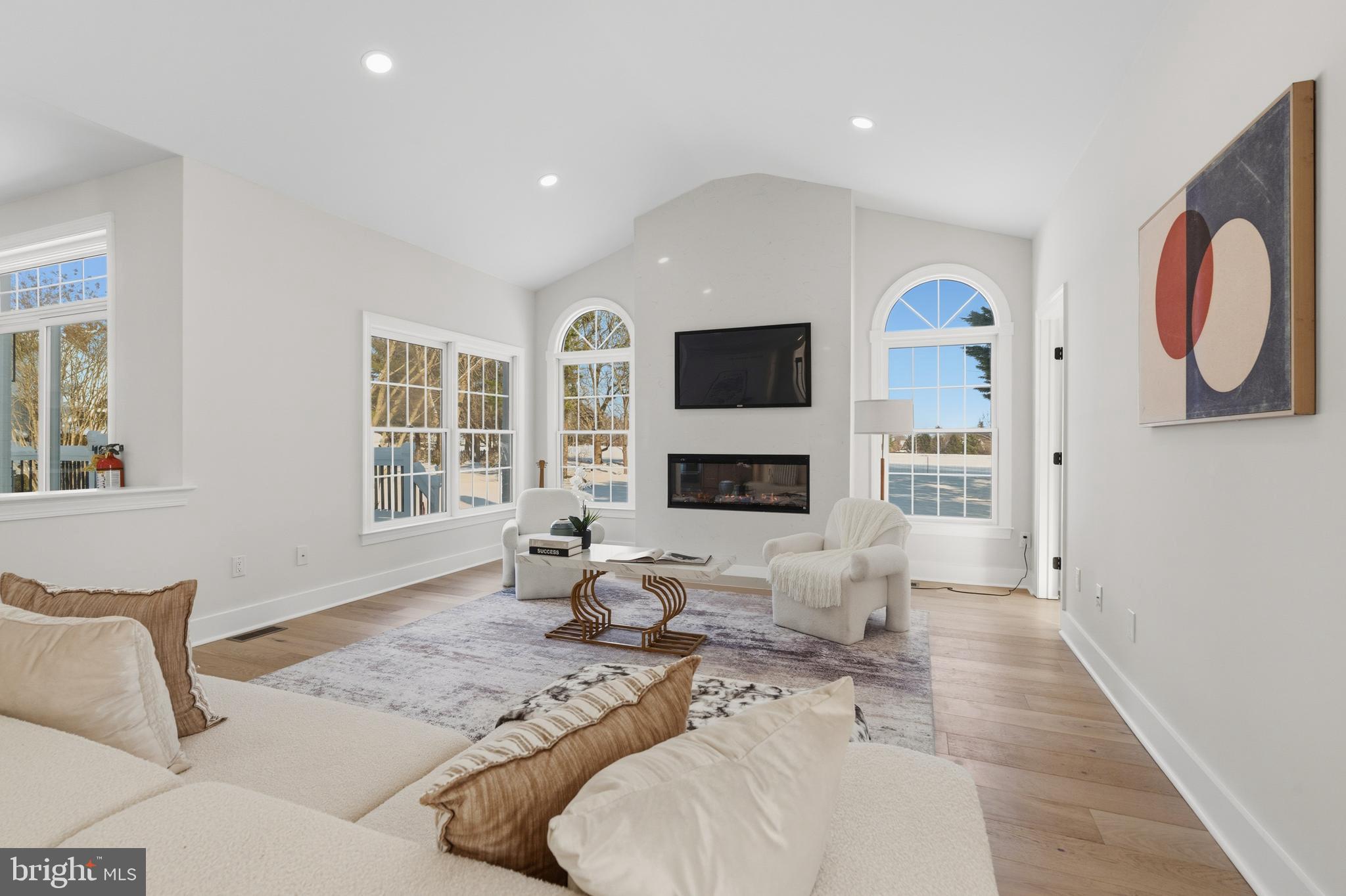 1586 Brookfield Road Newtown, PA 18940 - Photo 17 of 64 a living room with furniture a fireplace and a flat screen tv