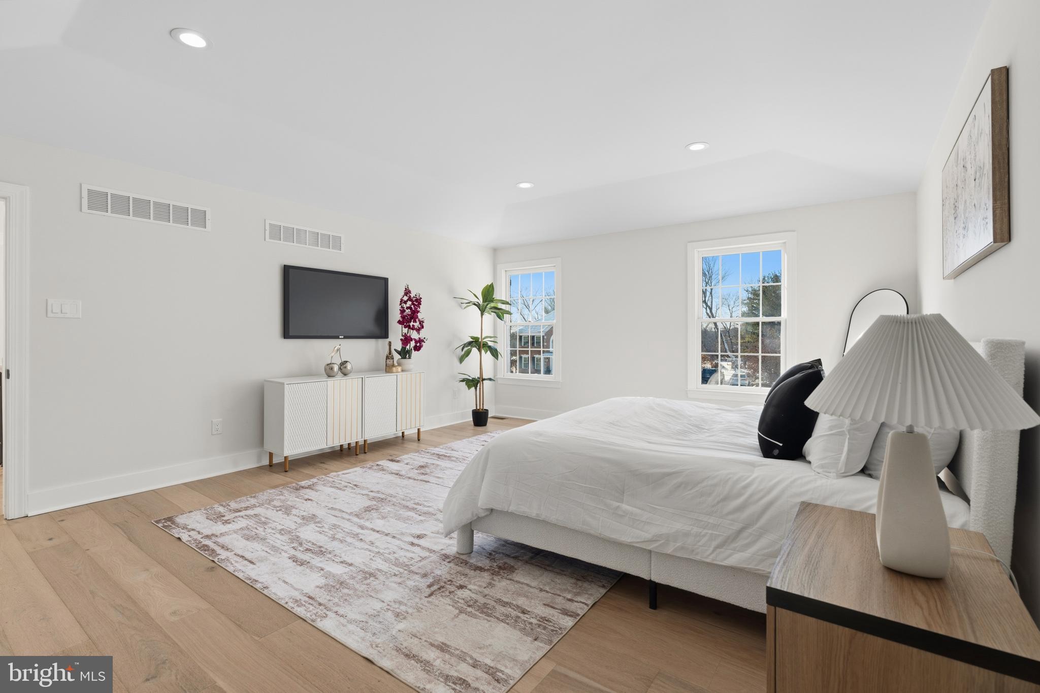 1586 Brookfield Road Newtown, PA 18940 - Photo 30 of 64 a bedroom with a bed and a flat screen tv