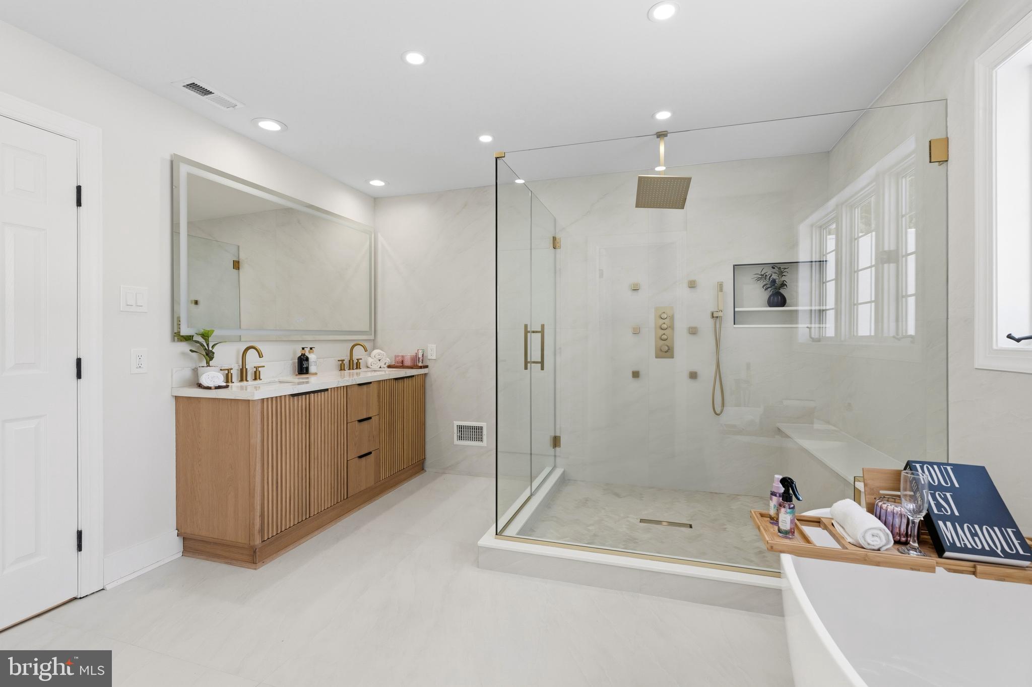 1586 Brookfield Road Newtown, PA 18940 - Photo 36 of 64 a bathroom with a tub a sink shower and mirror