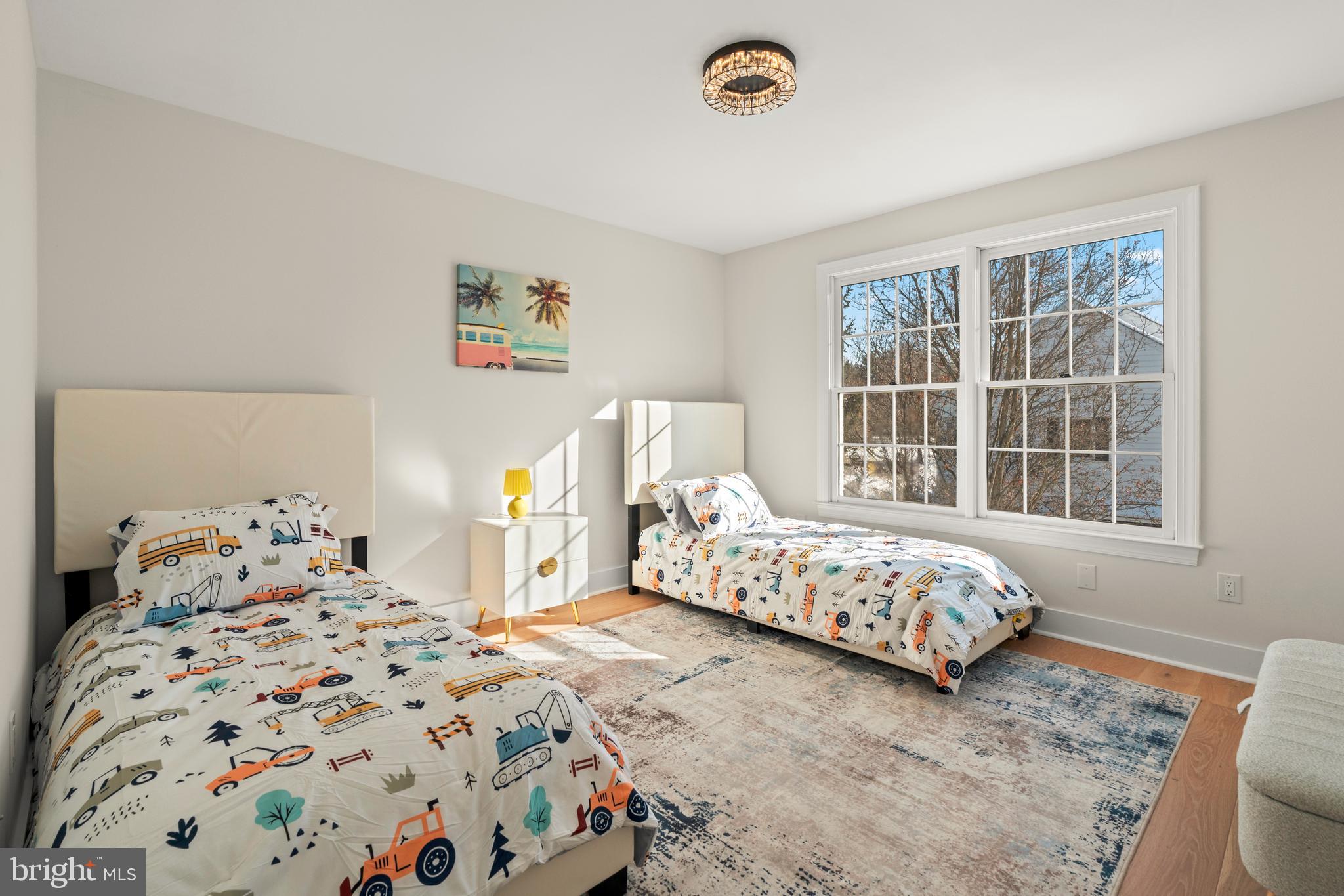 1586 Brookfield Road Newtown, PA 18940 - Photo 42 of 64 a bedroom with two beds and a window