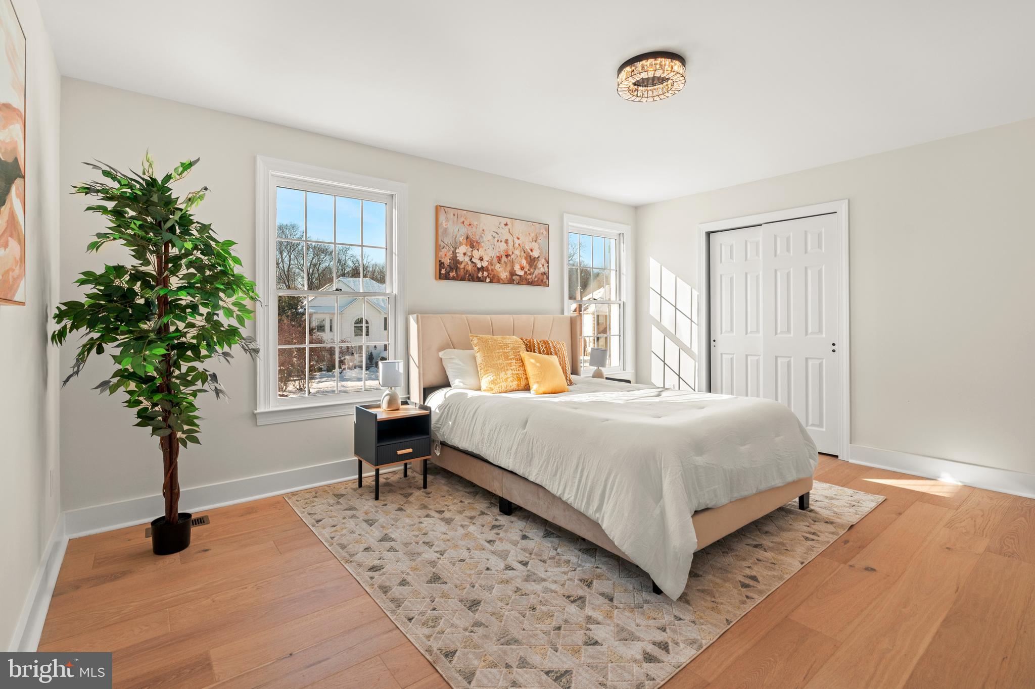 1586 Brookfield Road Newtown, PA 18940 - Photo 45 of 64 a bedroom with a bed and a potted plant