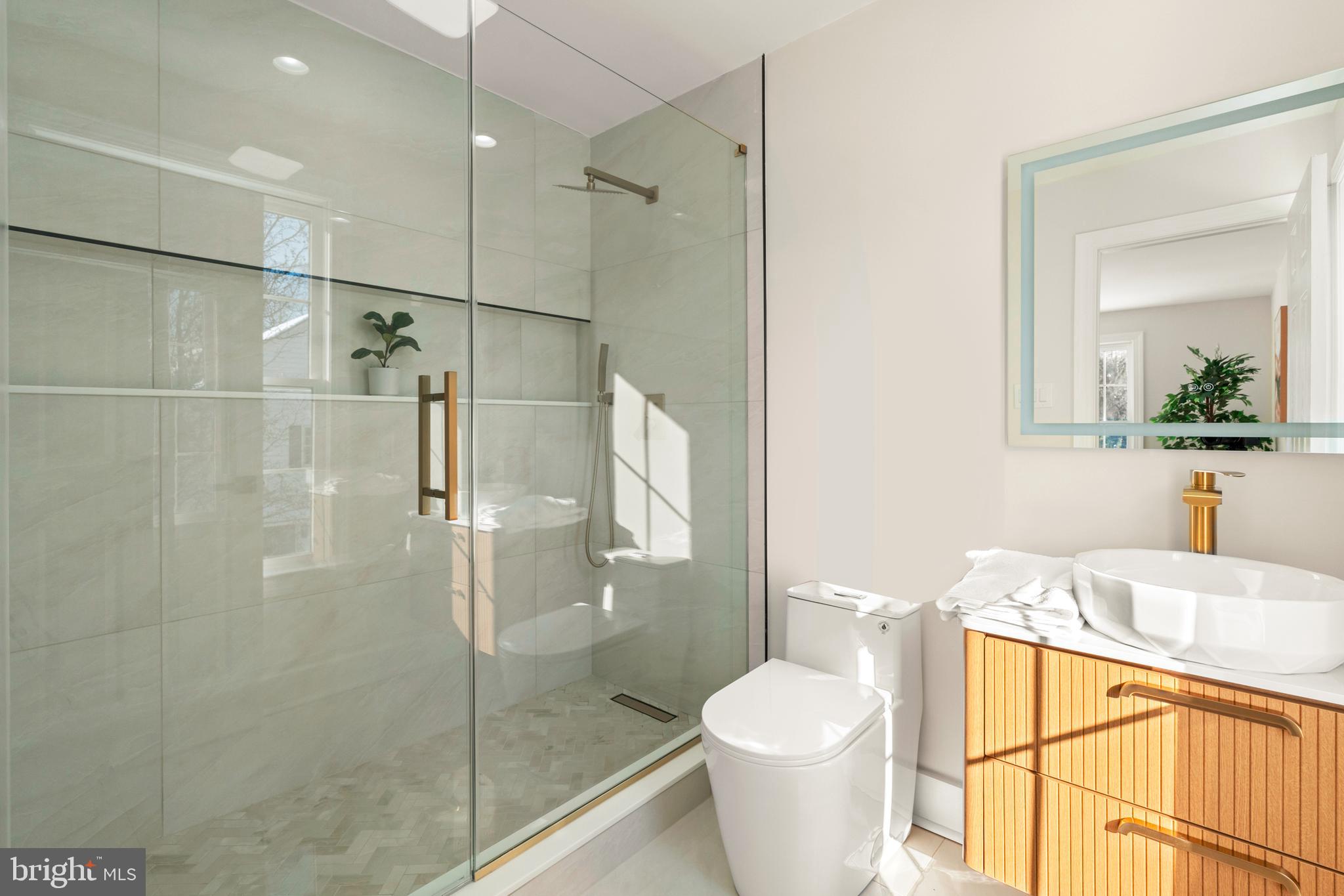 1586 Brookfield Road Newtown, PA 18940 - Photo 46 of 64 a bathroom with a sink toilet and shower