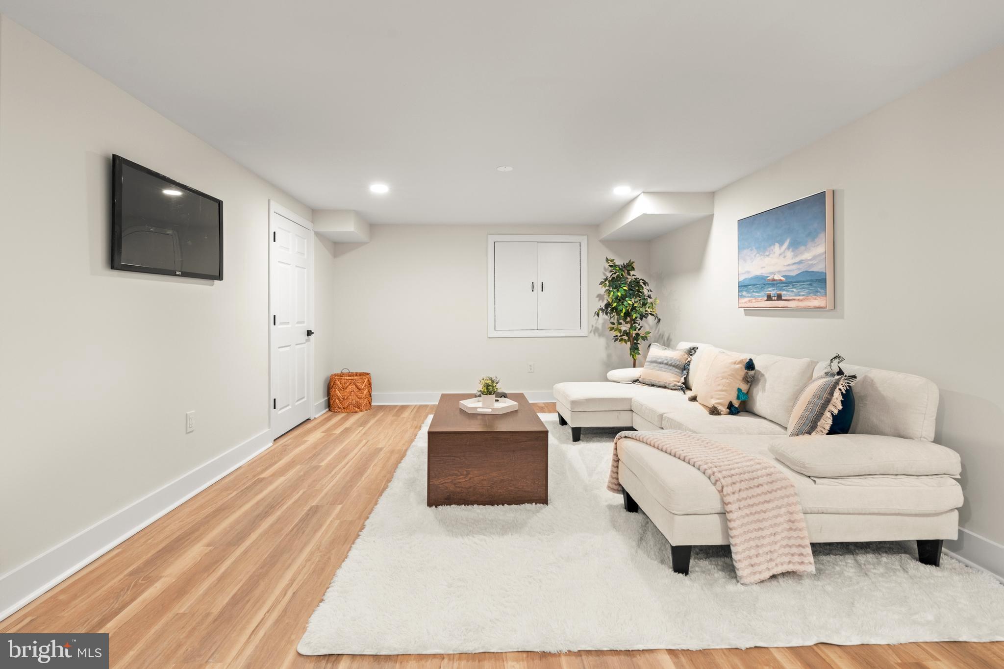 1586 Brookfield Road Newtown, PA 18940 - Photo 55 of 64 a bedroom with a bed and a couch