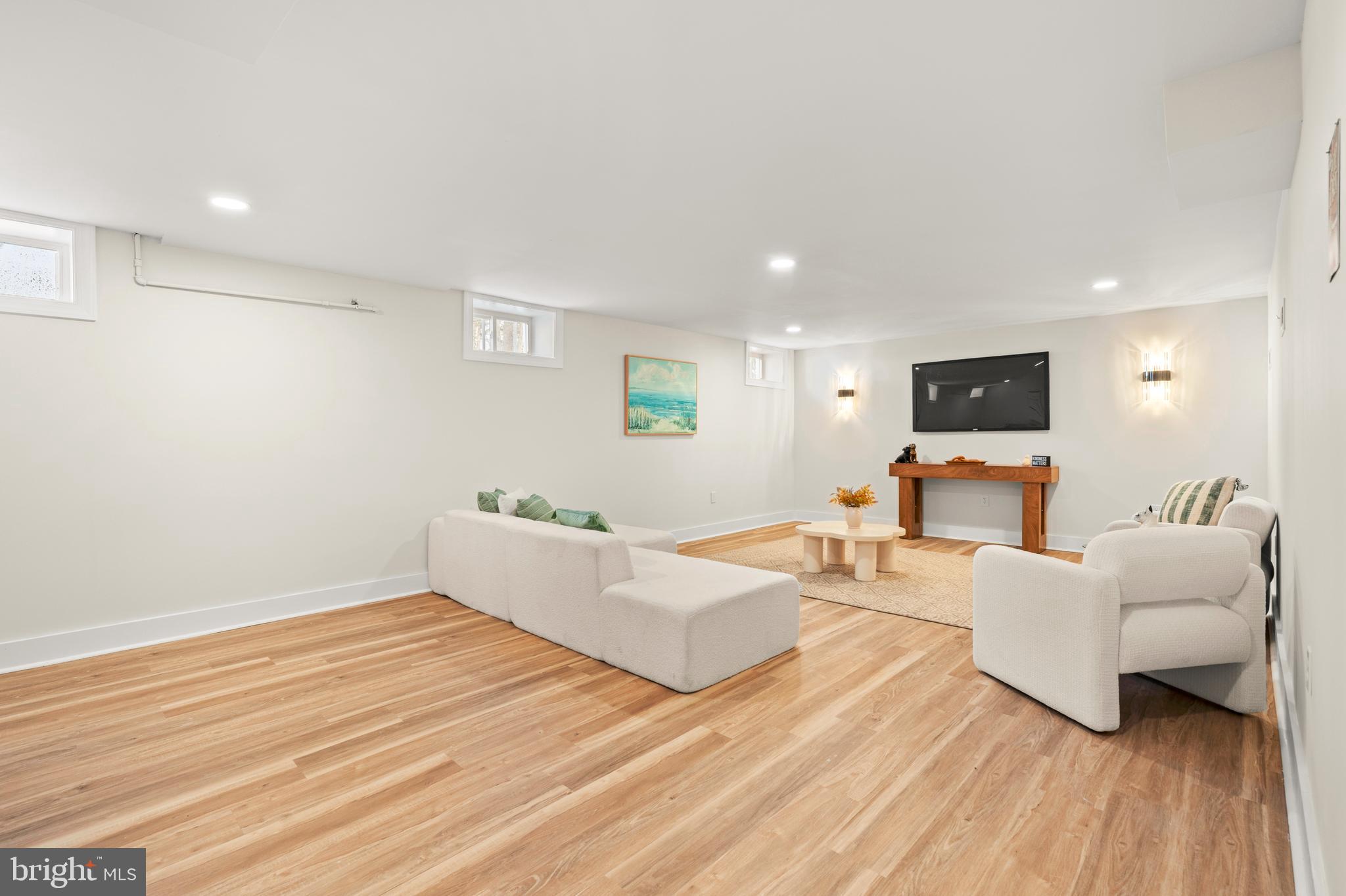 1586 Brookfield Road Newtown, PA 18940 - Photo 56 of 64 a living room with furniture and a flat screen tv