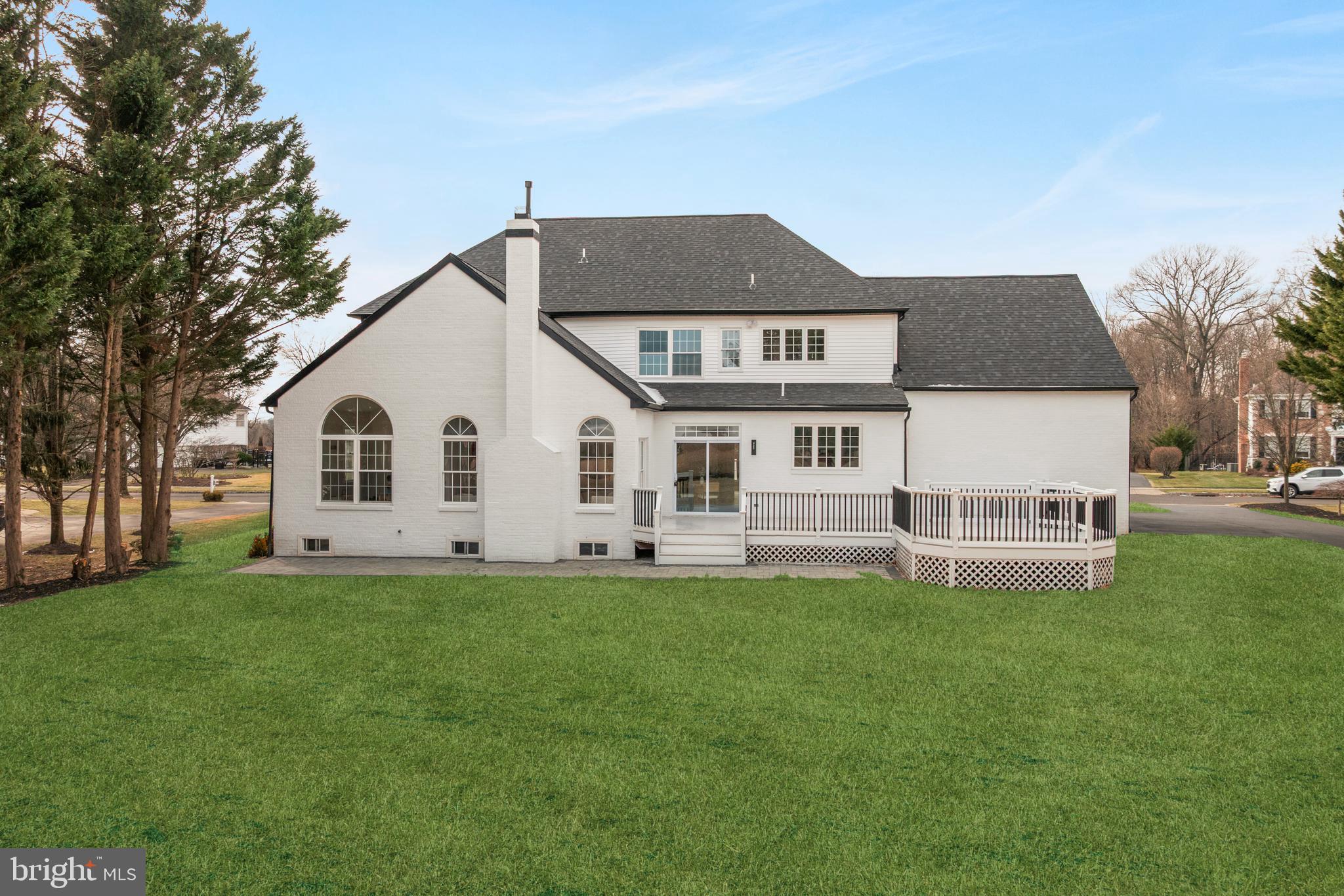 1586 Brookfield Road Newtown, PA 18940 - Photo 59 of 64 a front view of a house with a yard and trees