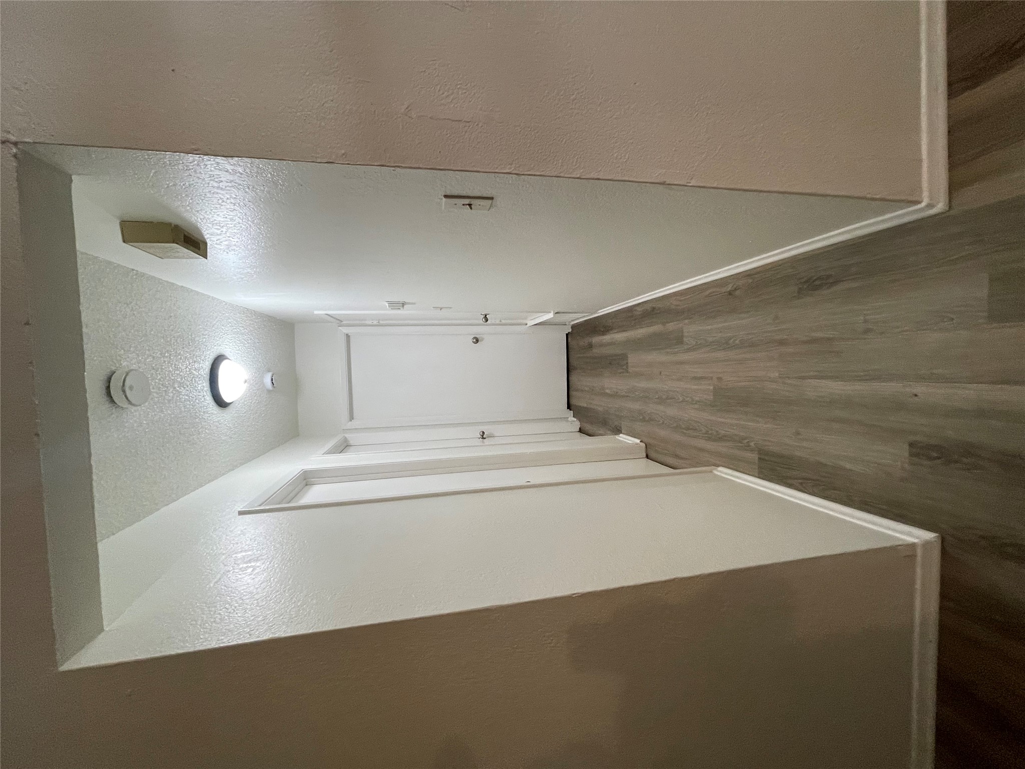 6206 Linda Lane, Unit A Austin, TX 78723 - Photo 4 of 19 a view of a hallway with wooden floor