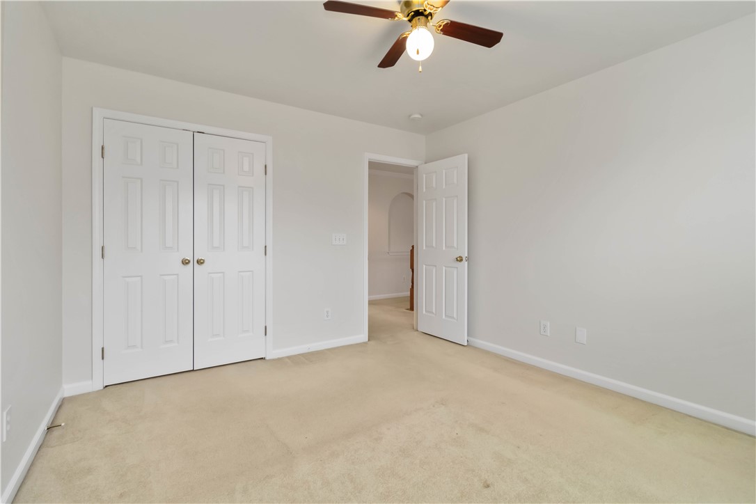 215 Ridge Bay Court Greenville, SC 29611 - Photo 19 of 35 This spacious bedroom offers ample natural light and a neutral palette, ready for your personal touch.