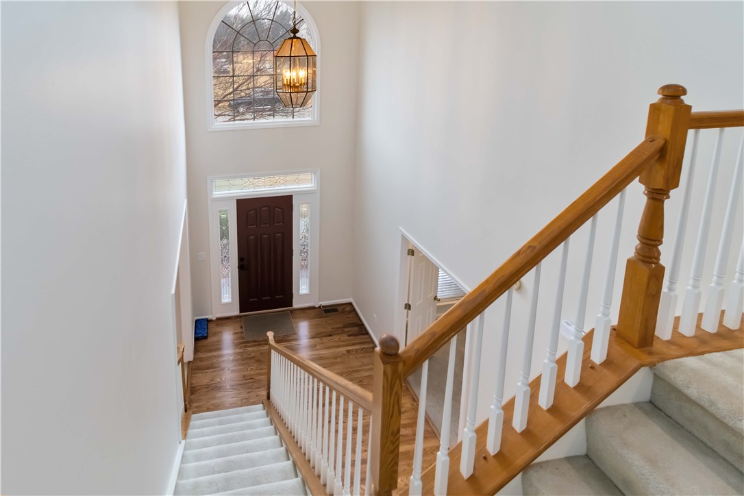 215 Ridge Bay Court Greenville, SC 29611 - Photo 2 of 35 Enter into a bright foyer featuring elegant hardwood flooring and a gracefully curved staircase.