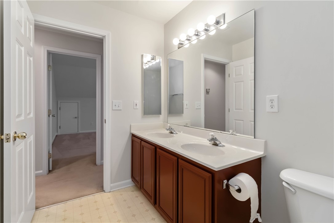 215 Ridge Bay Court Greenville, SC 29611 - Photo 24 of 35 This bathroom offers ample counter space, dual sinks, and plenty of storage.