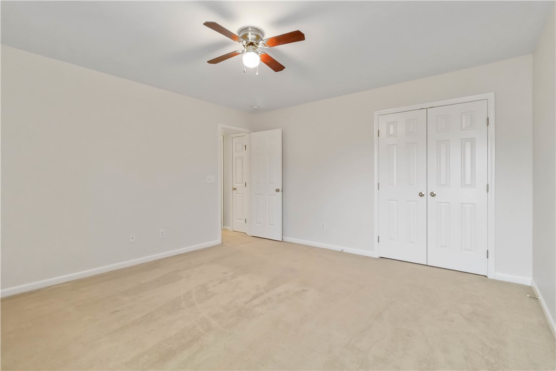 215 Ridge Bay Court Greenville, SC 29611 - Photo 25 of 35 Bright and airy room with carpeted flooring offers a blank canvas for personalization.