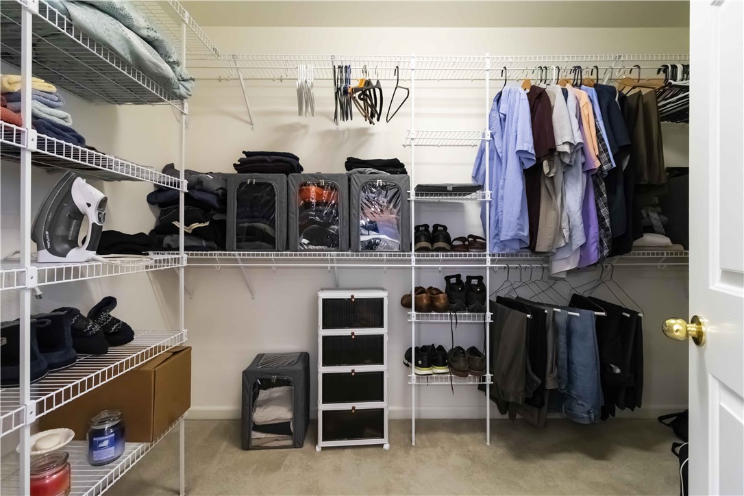 215 Ridge Bay Court Greenville, SC 29611 - Photo 30 of 35 This spacious walk-in closet features organized shelving and ample hanging space for all your storage needs.