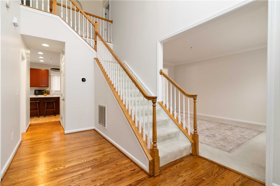 215 Ridge Bay Court Greenville, SC 29611 - Photo 6 of 35 This spacious foyer welcomes you with elegant stairs leading to upper and lower levels.