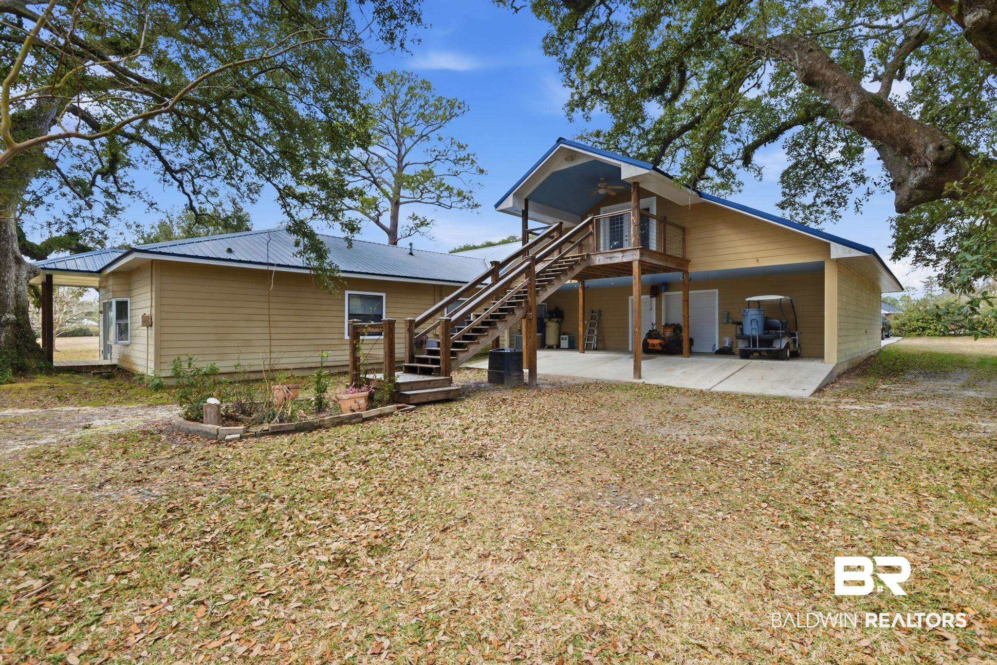 15025 Bellingrath Road Coden, AL 36523 - Photo 25 of 79 Back of house with a patio area, a metal roof, a deck, and a yard
