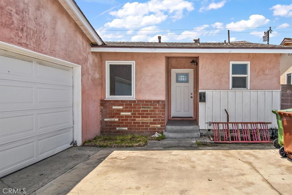1716 West Piru Street Compton, CA 90222 - Photo 16 of 17 a view of a house with a wooden fence