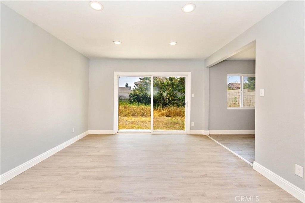 1716 West Piru Street Compton, CA 90222 - Photo 2 of 17 a view of an empty room with a window