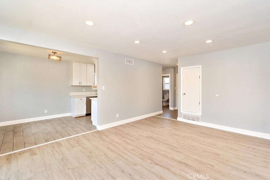 1716 West Piru Street Compton, CA 90222 - Photo 3 of 17 a view of empty room with wooden floor