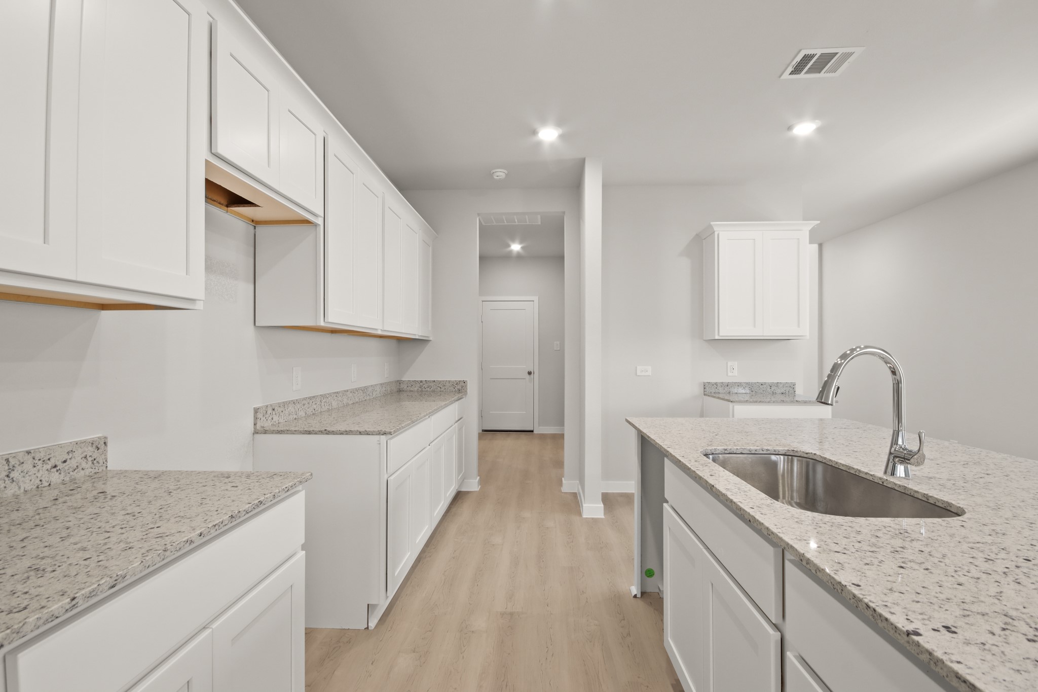 253 Spring Drive Hockley, TX 77447 - Photo 7 of 22 a kitchen that has a sink and a stove