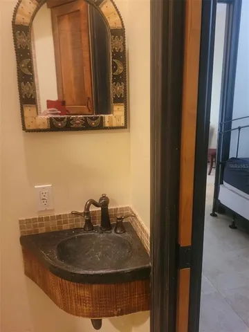 a kitchen with stainless steel appliances granite countertop a refrigerator a washer and dryer