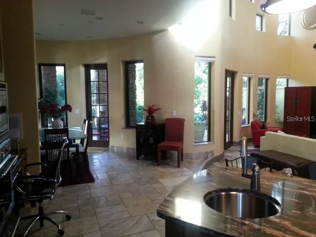 a dining room with furniture and window