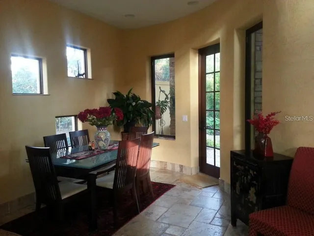 a kitchen with a sink refrigerator and cabinets