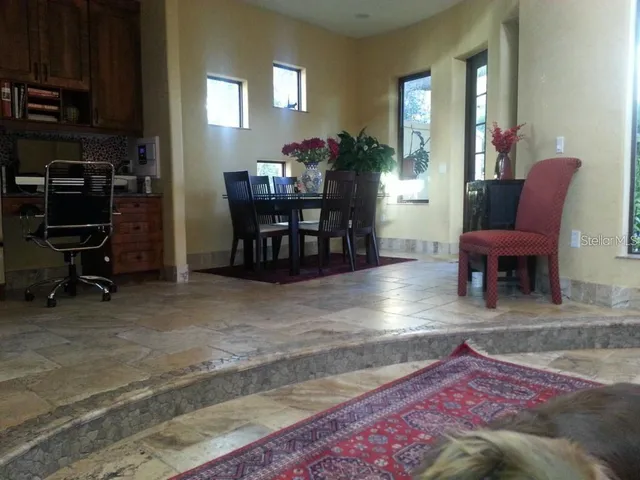 a living room with furniture and flat screen