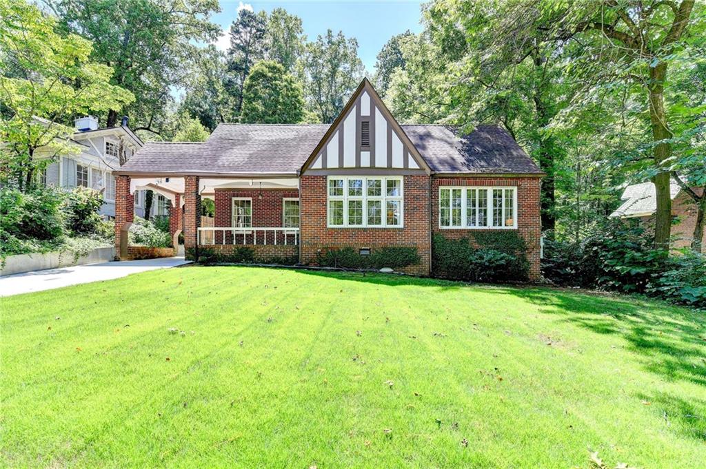 879 Clifton Road Northeast Atlanta, GA 30307 - Photo 1 of 1 front view of a house and a yard