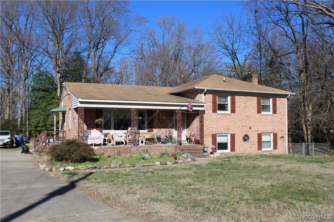 7410 Ewell Road Mechanicsville, VA 23111 - Photo 2 of 5 a view of a house with backyard and sitting area