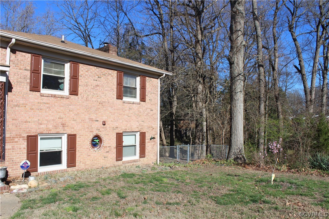 7410 Ewell Road Mechanicsville, VA 23111 - Photo 5 of 5 a front view of a house with a yard
