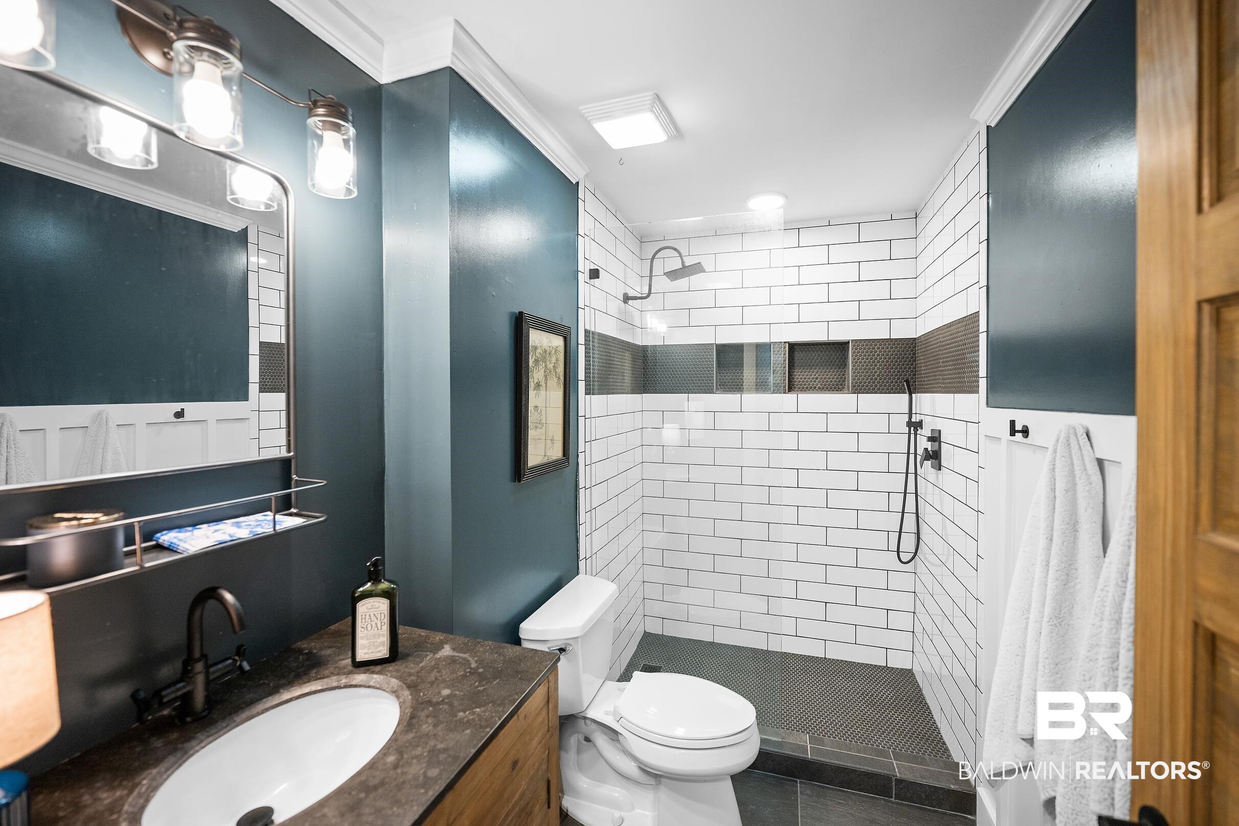 8490 Bay View Drive Foley, AL 36535 - Photo 34 of 67 Full bathroom featuring vanity, a shower stall, and ornamental molding
