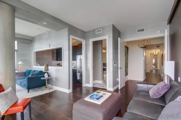 a view of a living room and a floor to ceiling window