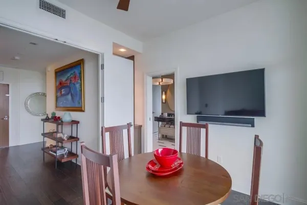 a view of kitchen with granite countertop cabinets and black stainless steel appliances