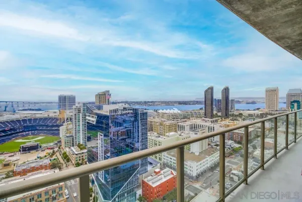 a hallway with wooden floor and windows