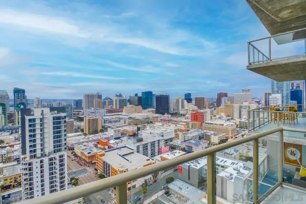 a bathroom with a tub sink shower and mirror