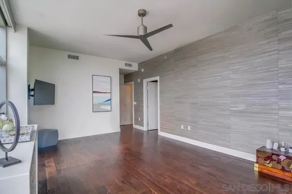 a living room with a couch and a night stand