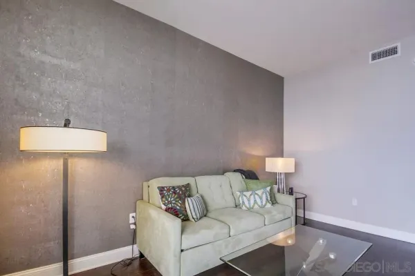 a view of a patio with couches and potted plants