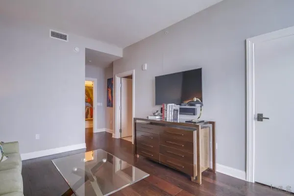 a view of a patio with couches table and chairs and potted plants