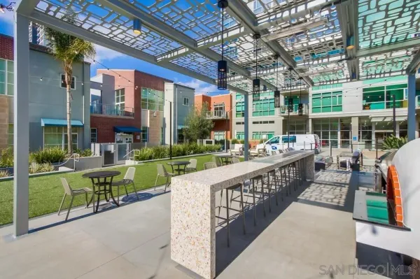 a living room with fireplace furniture and a floor to ceiling window