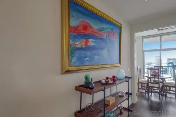 a living room with furniture and a floor to ceiling window