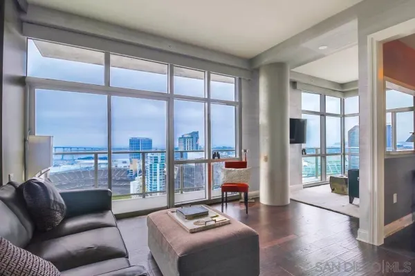 a living room with furniture and a large window