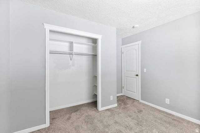 415 East 1150th Street North Logan, UT 84341 - Photo 13 of 38 Bedroom featuring light gray walls, gray carpet flooring, and white trim
