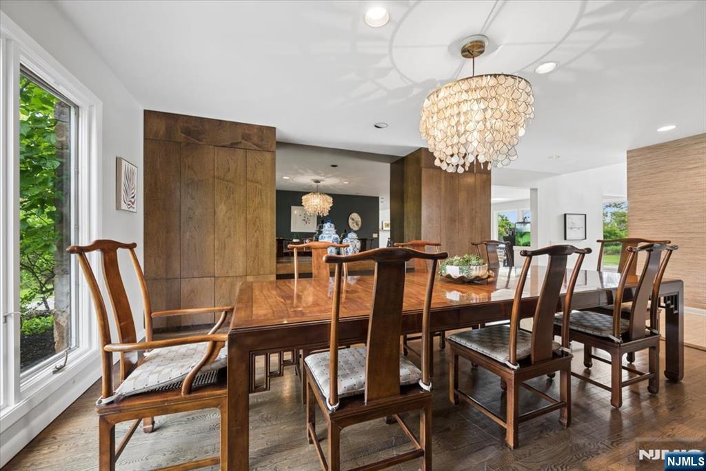 39 Eagle Nest Road Morris Township, NJ 07960 - Photo 16 of 43 a view of a dining room with furniture wooden floor and chandelier