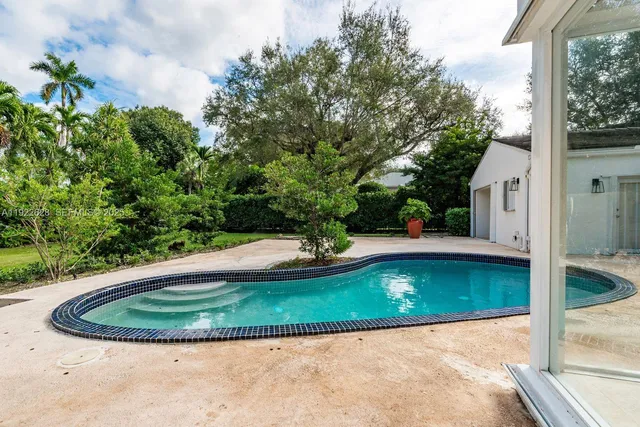 a bedroom with a bed and a desk