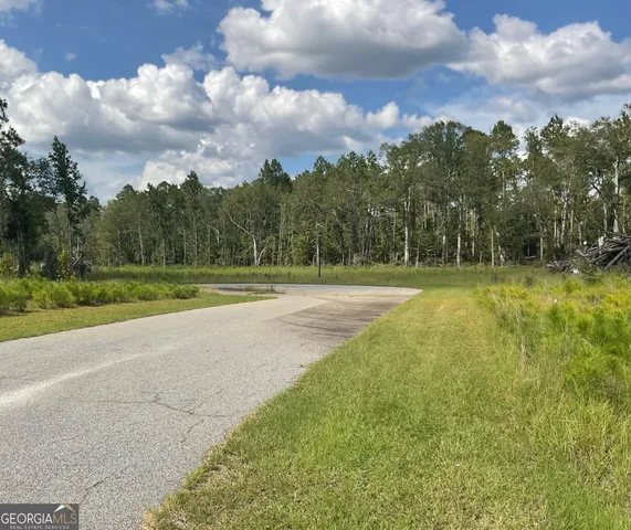 a view of a golf course with a lake
