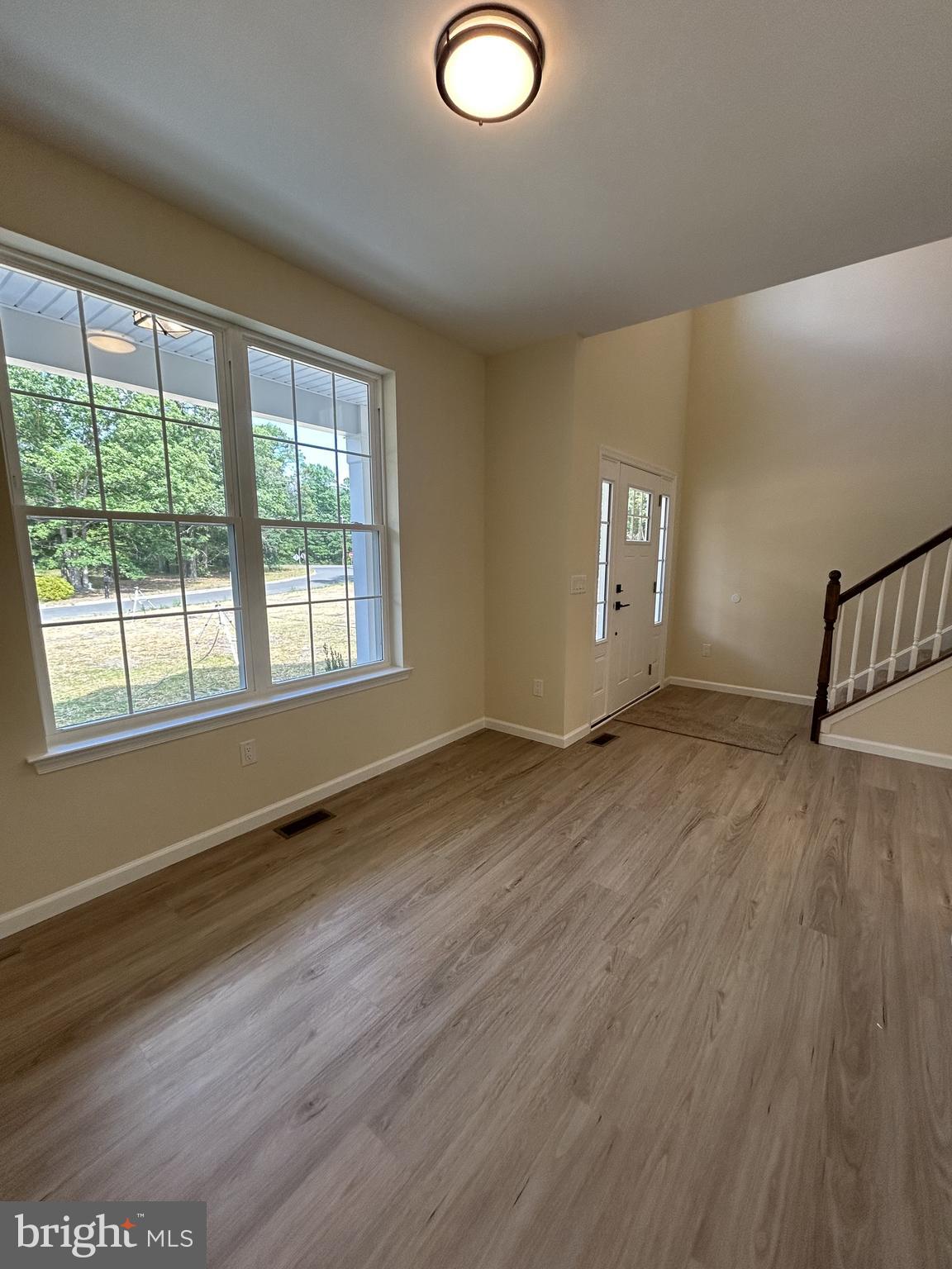 1178 South Spring Road Vineland, NJ 08361 - Photo 11 of 45 a view of empty room with wooden floor and fan