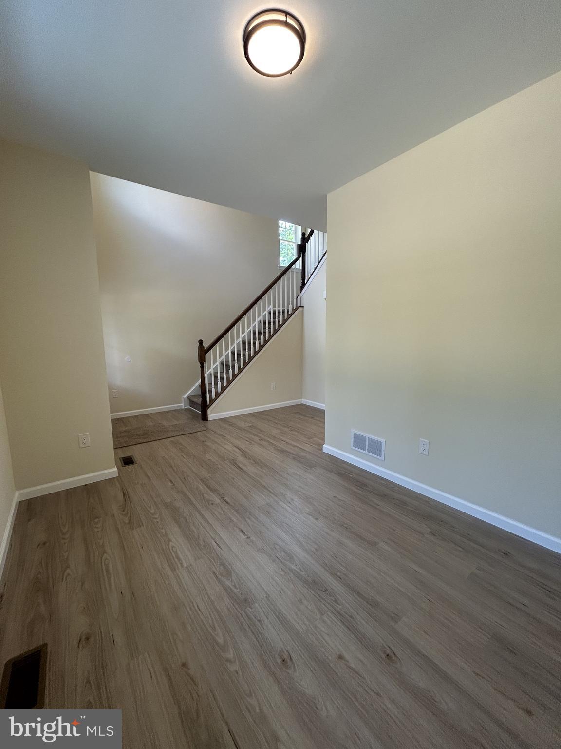 1178 South Spring Road Vineland, NJ 08361 - Photo 12 of 45 a view of entryway and hall with wooden floor